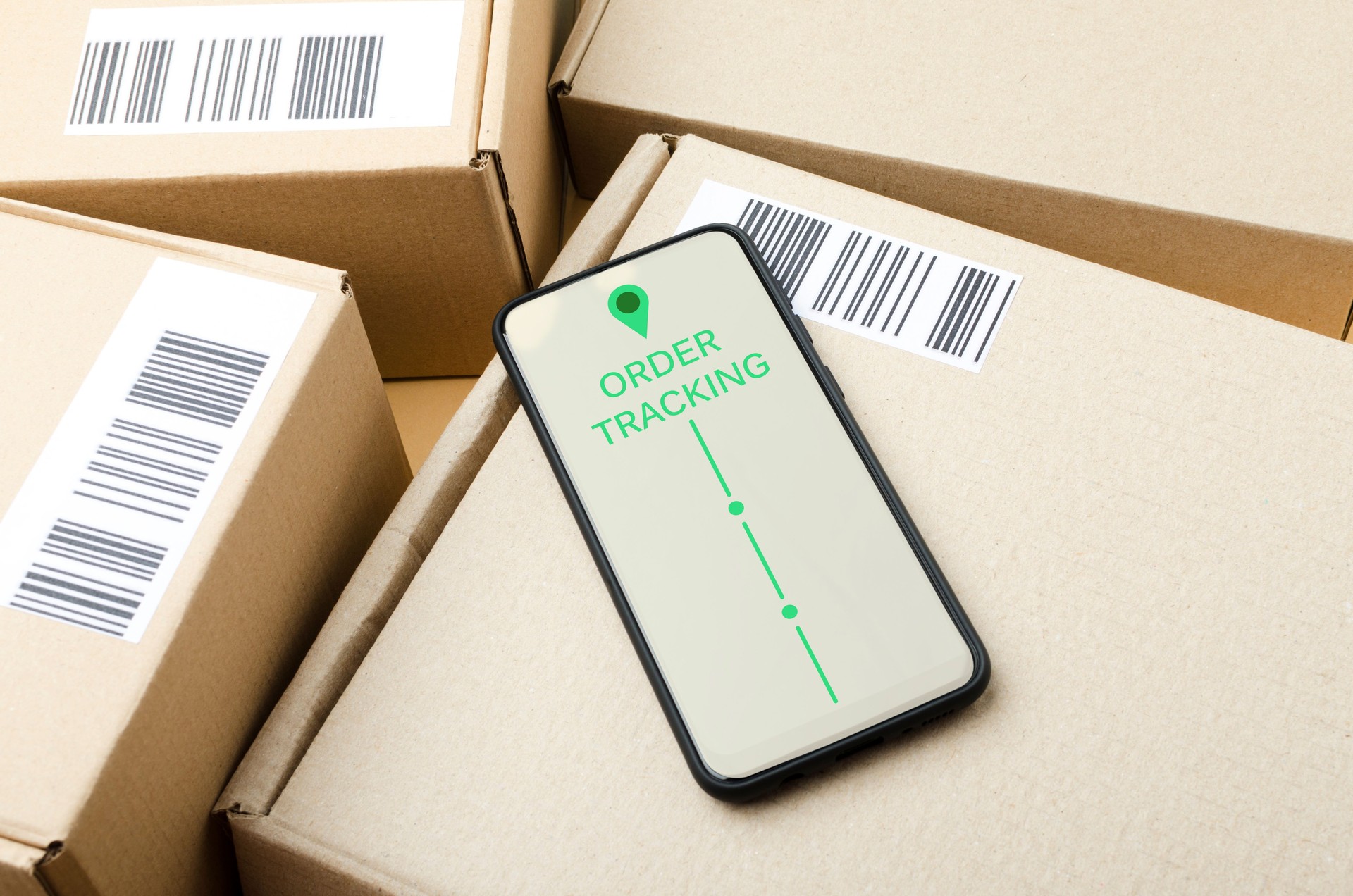 Lot of parcels and smartphone on it. Concept of order tracking